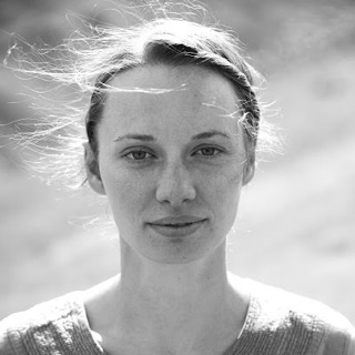 gazing into camera with wind in hair