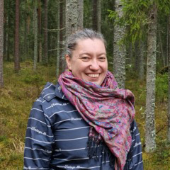 man wearing hood in icy and watery environs