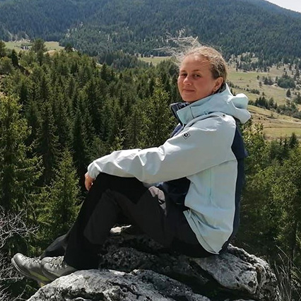 sitting sideways on rock